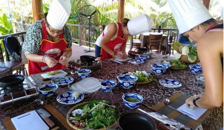 A cooking class for tourists at Tra Que Village in Hoi An