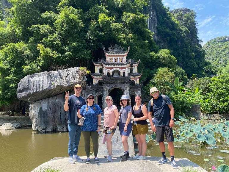 Tourists explore Bich Dong Pagoda